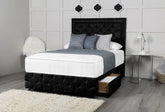 Bedroom with a black upholstered bed, white bedding, and decorative pillows.