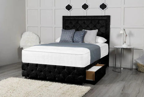 Bedroom with a black upholstered bed, white bedding, and decorative pillows.