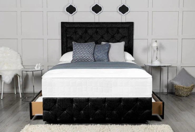 Bedroom with a black tufted bed frame and white bedding.