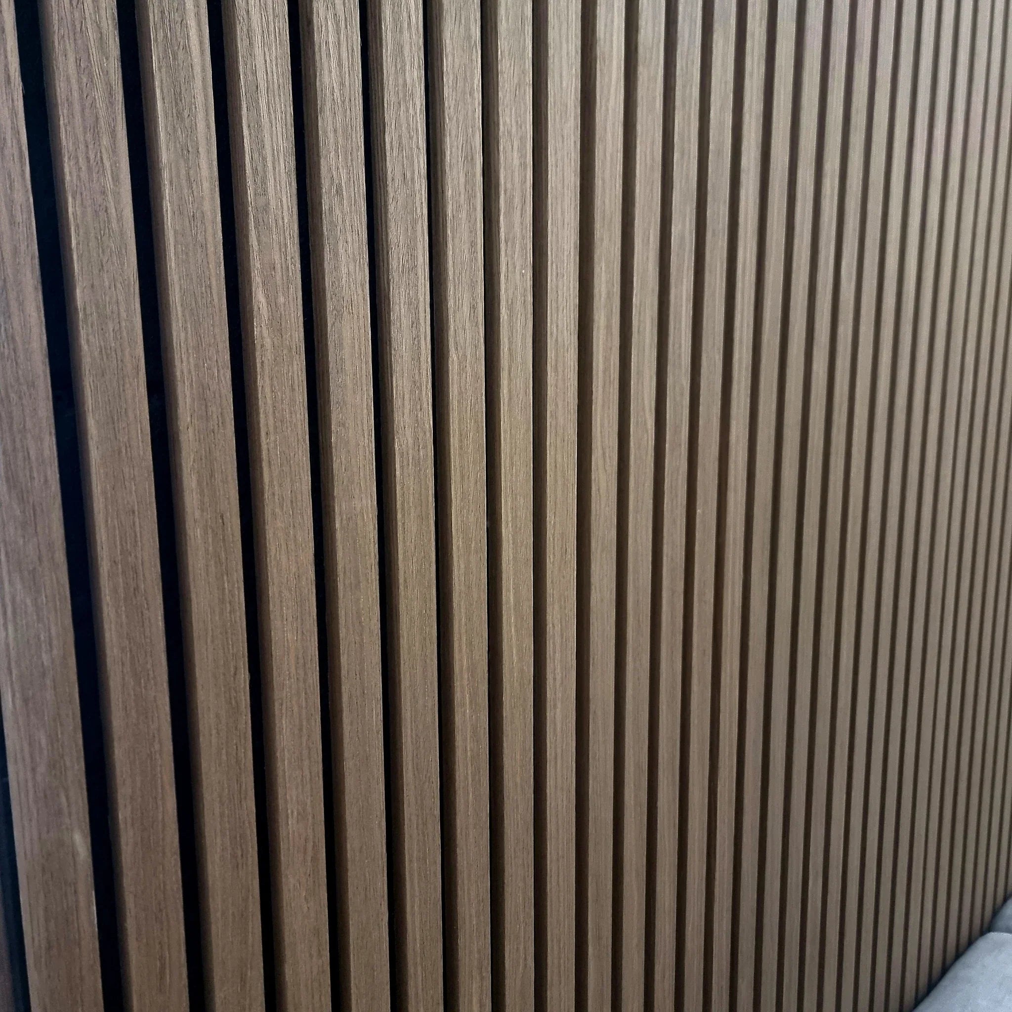 Dark oak slatted wall panel for modern interiors