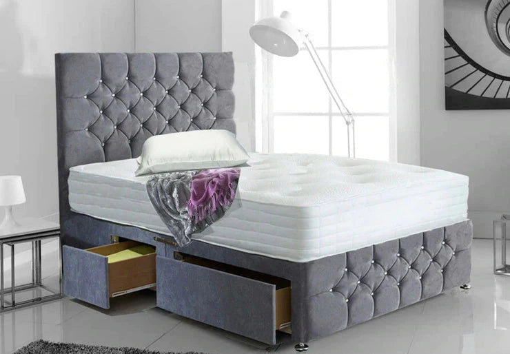Gray upholstered bed with tufted headboard and storage drawers in a modern bedroom.