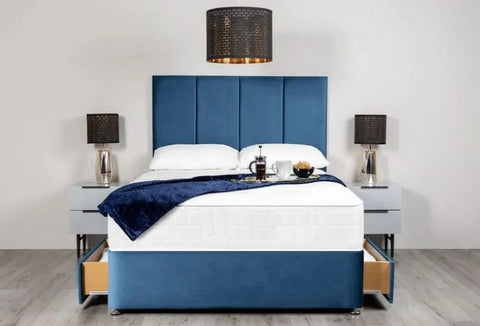 Blue and white bed with matching headboard and nightstands in a room setting.
