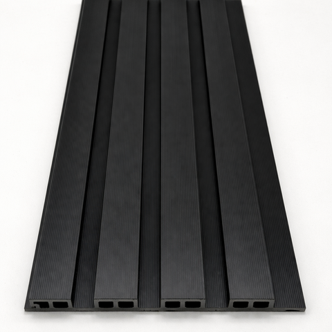 Black WPC outdoor wall cladding panels installed on modern garden wall

