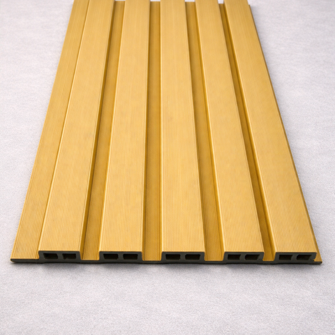 Modern grey WPC slat fence panel installed on outdoor deck area.


