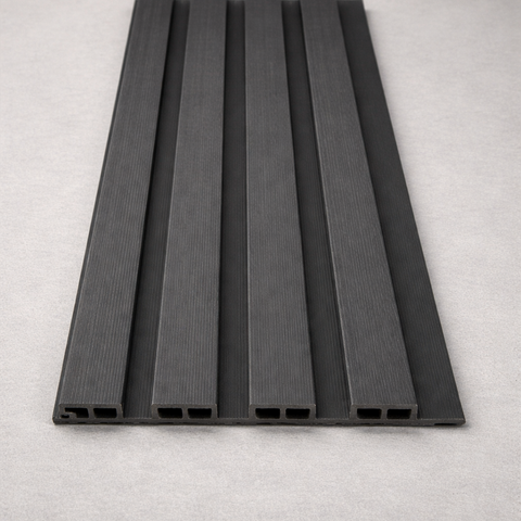 Grey composite slat wall panel used for modern outdoor fence and wall cladding.

