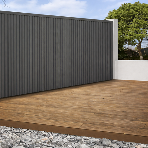 Textured charcoal grey composite wall panel for exterior fencing and cladding.

